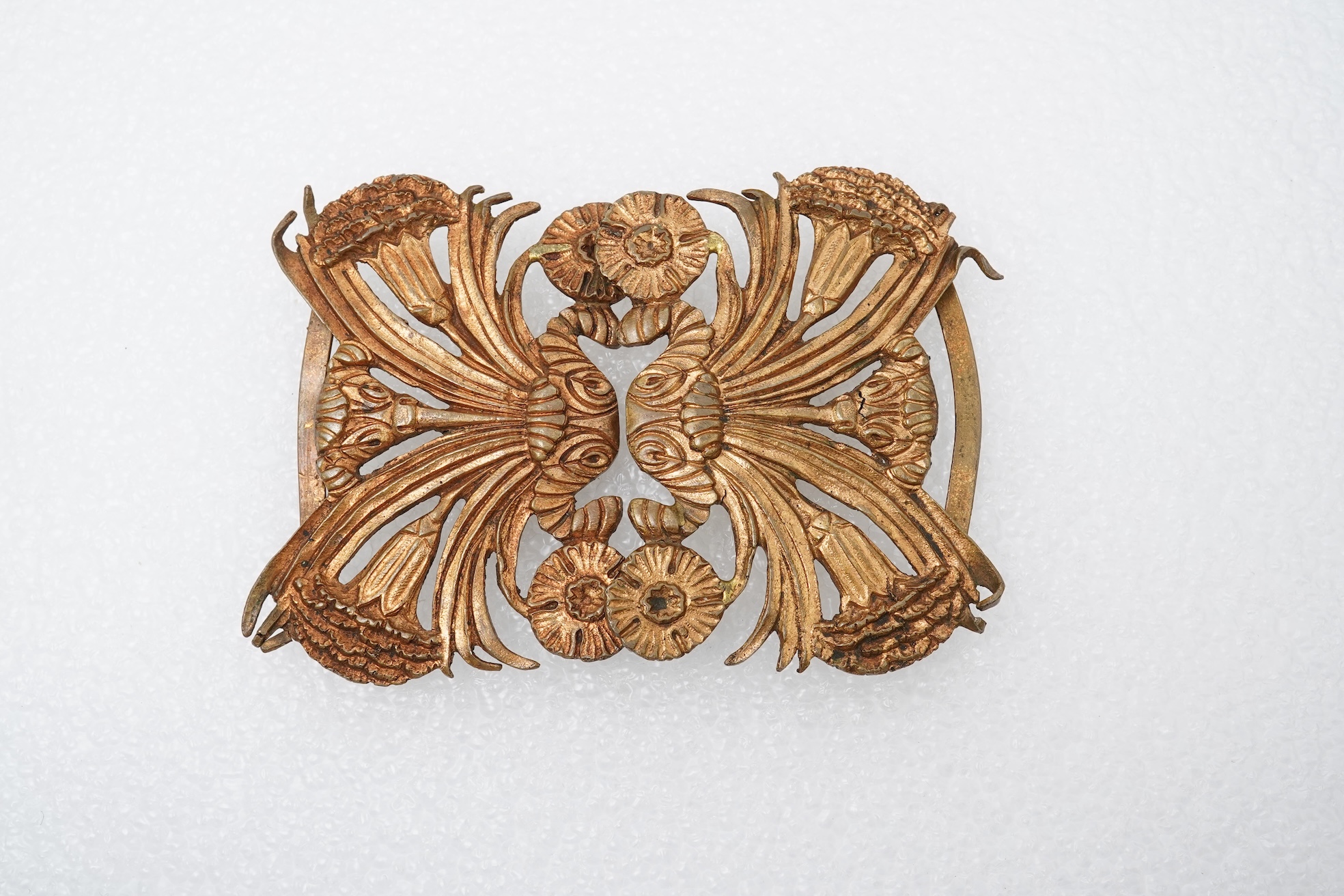 Line Vautrin, a gilt bronze belt buckle